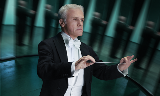 Banner featuring actor Christoph Waltz announcing Bitpanda Margin Trading. The text reads: Go long with up to 20x leverage on stocks, ETFs, and ETCs.